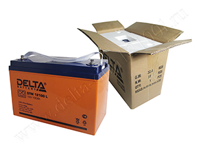 Открытая коробка и аккумулятор Delta DTM 12100 L рядом